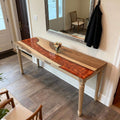 Modern entryway styling with a walnut epoxy resin console table, lava-like pearl pigment resin channel, and minimalist decor accents.