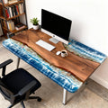 Modern home office scene showcasing a black walnut river epoxy desk with wave-like ocean resin patterns and rich natural grain.