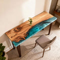 Olive wood epoxy resin console table in an entryway, featuring a pearlescent green resin river with shimmering powder effect and glossy finish.