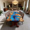 Luxury dining room interior featuring an olive wood blue epoxy river table, high-gloss finish, and organic wood contours for a statement centerpiece.