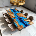 Olive wood epoxy resin dining table set for entertaining, with a bold ocean-blue river design and natural live edge tabletop in a classic dining space.