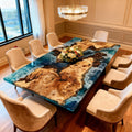 French poplar epoxy resin dining table in a luxury dining room, featuring an ocean-blue river epoxy with wave-like marbling and glossy finish.