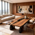 Modern living space featuring a walnut black river epoxy table as a statement centerpiece with warm wood panel walls.