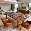 Contemporary lounge interior with a black walnut blue epoxy table, polished surface, and modern seating in the background.