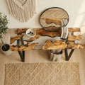 Entryway styling scene with an olive wood epoxy console table, round mirror, woven wall decor, and minimalist accessories.