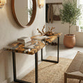 Neutral entryway interior with an Italian olive wood epoxy console table, showcasing floating wood pieces in transparent resin.