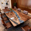 Modern office conference room featuring a black walnut silver river epoxy table, clean minimalist decor, and presentation-ready seating.