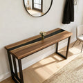 Entryway vignette showcasing a black walnut epoxy resin console table with sleek black resin channel and contemporary styling.