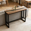 Contemporary hallway interior with a black walnut black epoxy console table, clean lines, and warm wood tone contrast.