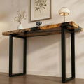 Entryway vignette featuring an olive wood epoxy resin sofa table, black resin channel design, and clean contemporary decor.