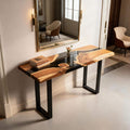 Entryway vignette showcasing a walnut epoxy resin console table with sleek black resin channel and contemporary styling.