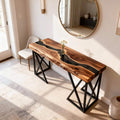 Modern living room scene with a walnut black river epoxy sofa table, styled behind the couch with minimalist decor accents.