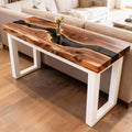 Entryway vignette showcasing a walnut epoxy resin console table with sleek black resin channel and contemporary styling.