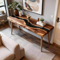 Behind-the-couch setup featuring a walnut epoxy resin sofa table, deep black resin inlay, and polished surface reflections.