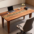 Home office scene with a walnut river epoxy desk, clear resin “creek” filled with smooth pebbles and natural wood grain.