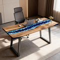 Private office desk scene with a black walnut epoxy resin tabletop, deep blue resin river design, and contemporary wooden base.