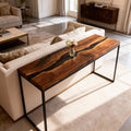 Open-concept home interior showcasing a black walnut black river epoxy table with high-gloss finish and statement tabletop character.